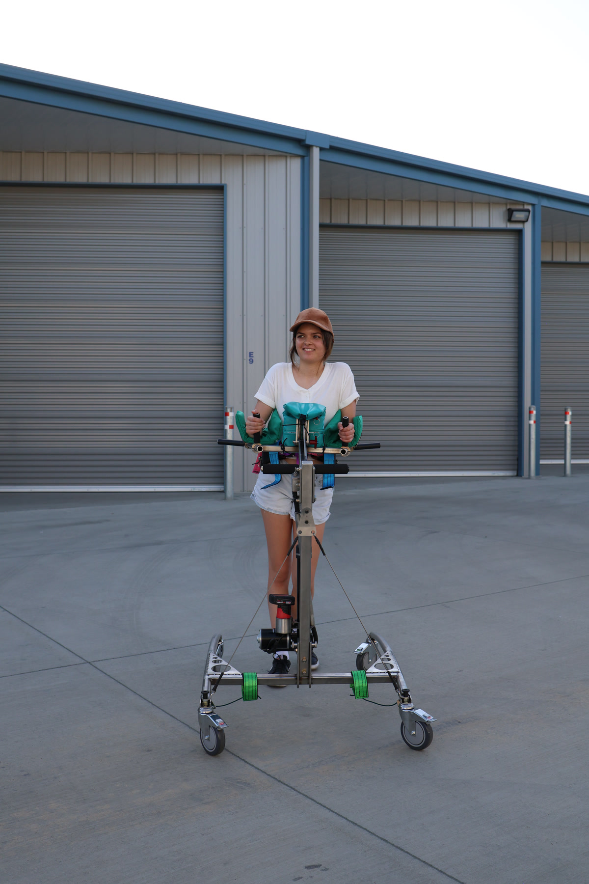 Caregiver and patient beside the Traveler mobility device